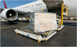 Secure Cargo being loaded onto an aircraft on tarmac.